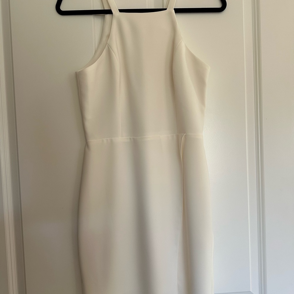 Ivory sleeveless high neck dress with slit
